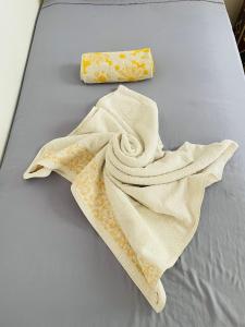 a towel and a soap on a bed at Riad Diamant La Ville Rouge in Marrakesh +101 photos