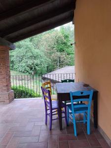 a table and chairs sitting on a patio at Passione Peonie Apartment in Roccabruna +38 photos