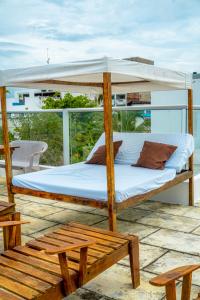 a bed on the deck of a boat at Open Sea Hotel Cartagena - Frente al mar in Cartagena de Indias
