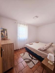 Posteľ alebo postele v izbe v ubytovaní Apartments Vugica Šilo