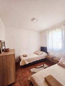 Posteľ alebo postele v izbe v ubytovaní Apartments Vugica Šilo