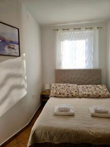 Posteľ alebo postele v izbe v ubytovaní Apartments Vugica Šilo