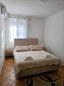 Posteľ alebo postele v izbe v ubytovaní Apartments Vugica Šilo