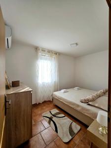 Posteľ alebo postele v izbe v ubytovaní Apartments Vugica Šilo