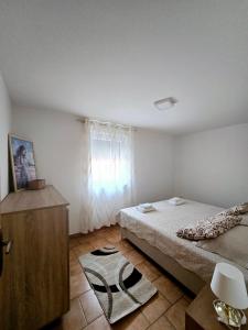 Posteľ alebo postele v izbe v ubytovaní Apartments Vugica Šilo