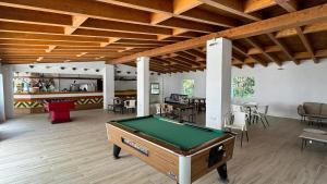 a room with a pool table in the middle of it at Camping Turismar in Tossa de Mar
