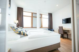 Ein Bett oder Betten in einem Zimmer der Unterkunft BO Hotel Hamburg