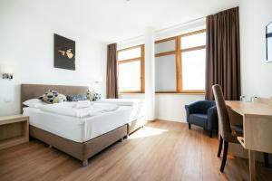 Ein Bett oder Betten in einem Zimmer der Unterkunft BO Hotel Hamburg