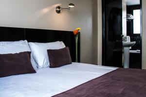 Ένα ή περισσότερα κρεβάτια σε δωμάτιο στο Épico Recoleta Hotel