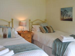 Katil atau katil-katil dalam bilik di Clematis Cottage +10 gambar