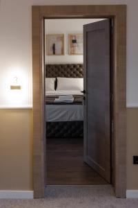 Katil atau katil-katil dalam bilik di Garni Hotel Maggitti