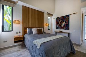 Postel nebo postele na pokoji v ubytování Synergy Retreats Costa Rica, Uvita, Puntarenas