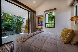 Postel nebo postele na pokoji v ubytování Synergy Retreats Costa Rica, Uvita, Puntarenas
