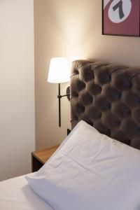 Katil atau katil-katil dalam bilik di Garni Hotel Maggitti
