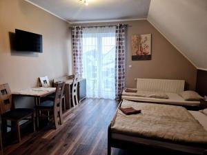 Posteľ alebo postele v izbe v ubytovaní Apartamenty Otylka