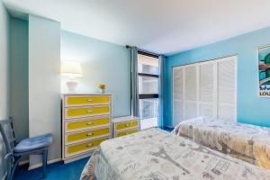 a bedroom with two beds and a window at Sea Colony - 501 Brandywine House Rd in Bethany Beach +34 photos