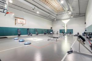 a gym with a basketball hoop and a basketball court at Sea Colony - 501 Brandywine House Rd in Bethany Beach