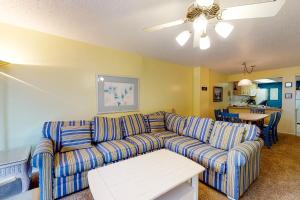 a living room with a couch and a table at Sea Colony - 107 Brandywine House Rd in Bethany Beach