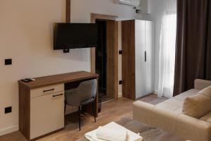 Televisyen dan/atau pusat hiburan di Garni Hotel Maggitti