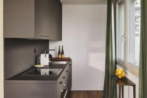 Kuchyň nebo kuchyňský kout v ubytování aestate living lakeview in Horgen Zürich Zug Pfäffikon