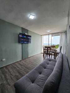 Et opholdsområde på Apartamento en Armenia - Con Piscina