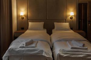 Katil atau katil-katil dalam bilik di Garni Hotel Maggitti