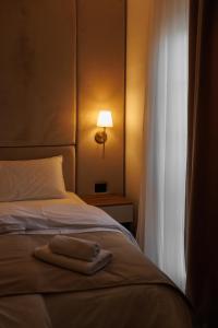 Katil atau katil-katil dalam bilik di Garni Hotel Maggitti