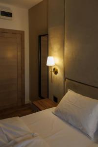 Katil atau katil-katil dalam bilik di Garni Hotel Maggitti