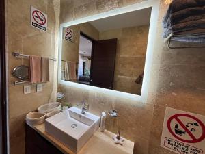 a bathroom with a sink and a mirror at Apartment with Excellent Ocean View, Terra 194 in Cabo San Lucas +11 photos