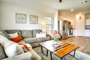 a living room with a couch and a table at 12 Mi to Avery Island Spacious Family Home! in New Iberia