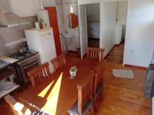 an overhead view of a kitchen with a table and chairs at Refugio Amaicha in Embalse