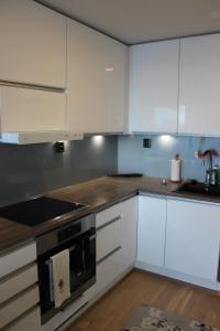 Kuchyň nebo kuchyňský kout v ubytování Ranta-Tampellan Helmi + 12 fotografií