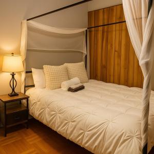 a bedroom with a white bed with a canopy at Spacious 4BR near NYC with Parking, 10min MetLife, 20min Times Sq in North Bergen +31 photos