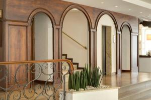 a staircase in a building with arched ceilings and a lobby at Hotel Byron Bellavista in Lido di Jesolo +45 photos