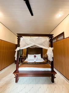 Postel nebo postele na pokoji v ubytování Kajeng Bungalow