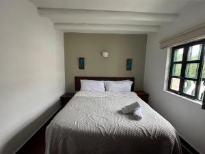 Postel nebo postele na pokoji v ubytování Hotel abahunza by santuario