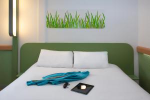 Postel nebo postele na pokoji v ubytování ibis budget Chambéry Sud Challes Les Eaux + 34 fotografií