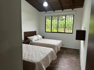 Postel nebo postele na pokoji v ubytování Miramonte Chipata