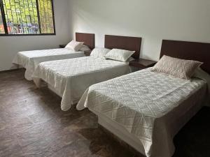 Postel nebo postele na pokoji v ubytování Miramonte Chipata