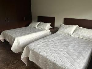 Postel nebo postele na pokoji v ubytování Miramonte Chipata