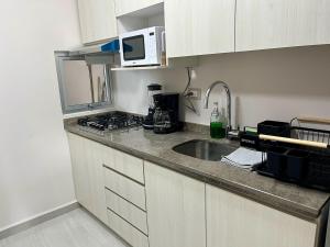 Kuchyň nebo kuchyňský kout v ubytování Modern Oceanfront Retreat 2BD 2BDR Wifi Pool