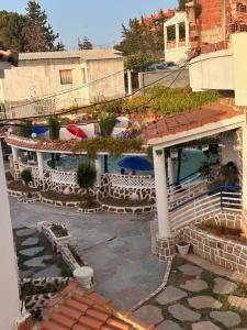 an aerial view of a building with a patio at Résidence île des Pisans Nezla in Bejaïa
