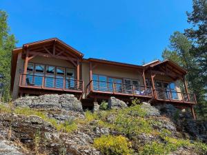 a house on top of a mountain at Townhome next to Clubhouse in Exclusive Eagle Bend - The Glacier in Bigfork