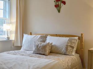 Katil atau katil-katil dalam bilik di Mill Pond Cottage
