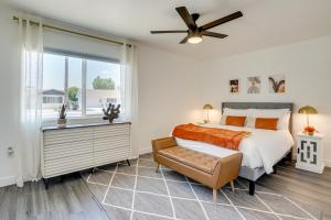 a bedroom with a bed and a window at 5 Mi to State Farm Stadium Sun City Retreat in Sun City