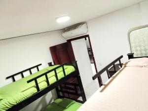 a room with two bunk beds and a mirror at Condo-Panoramic Elevator-10 Min Walk-Rodadero Beach in Santa Marta +48 photos