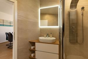 a bathroom with a sink and a shower at Apartment Paula in Novalja +19 photos