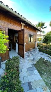 a house with a door leading into a yard at Casa na orla in Porto Seguro +10 photos
