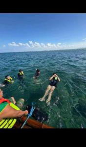 a group of people in the water on a boat at Yanis Resort in Calatagan