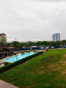 a view of a swimming pool in a park at CondoStaycation at One Oasis CDO in Cagayan de Oro +3 photos